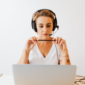 Woman with Headphones Working Remotely