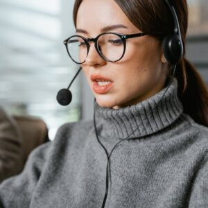 Portrait of a Woman Wearing a Black Headset