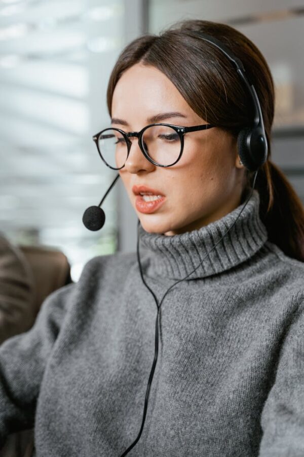 Portrait of a Woman Wearing a Black Headset